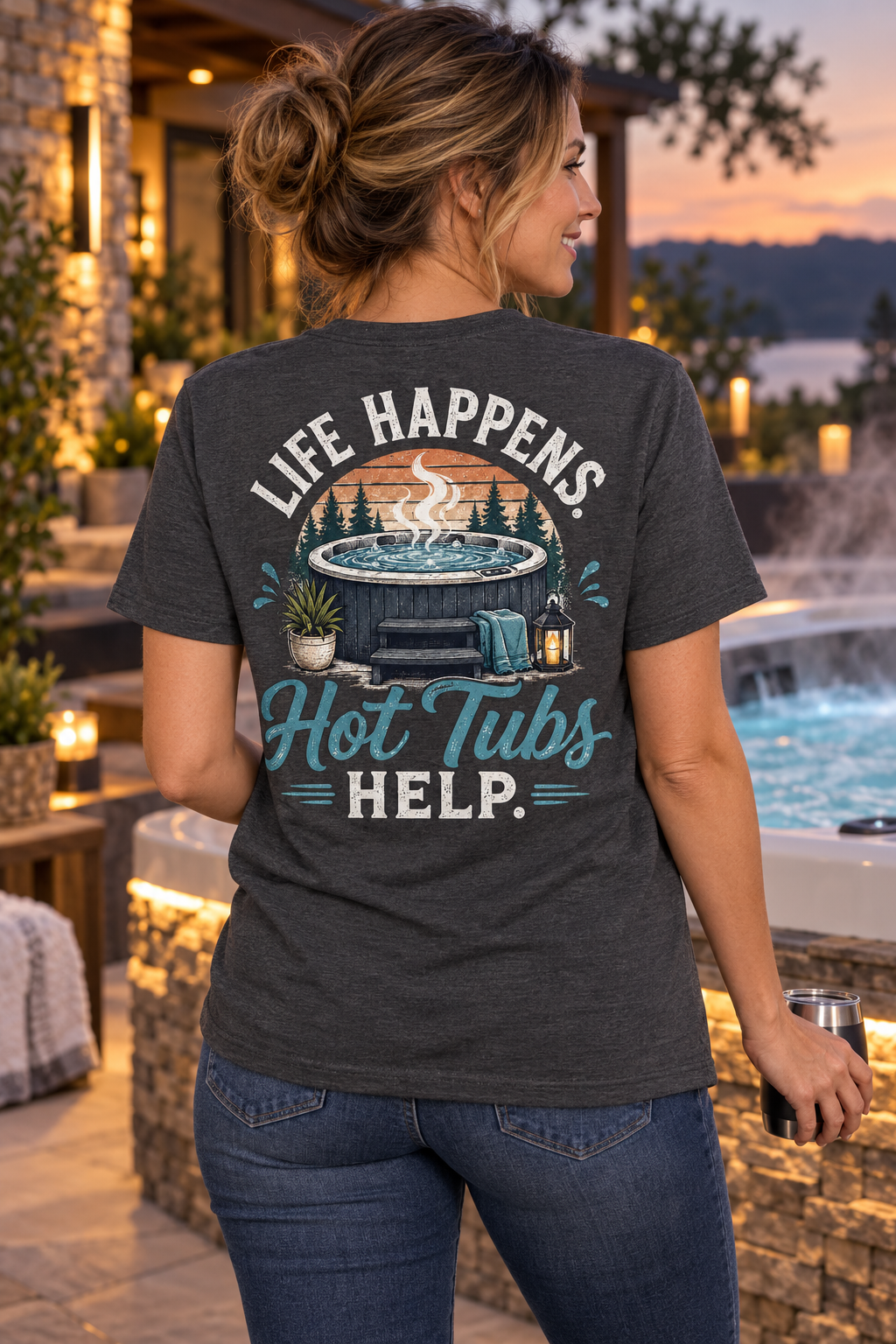Model wearing Life Happens. Hot Tubs Help. hot tub T-shirt beside a luxury spa